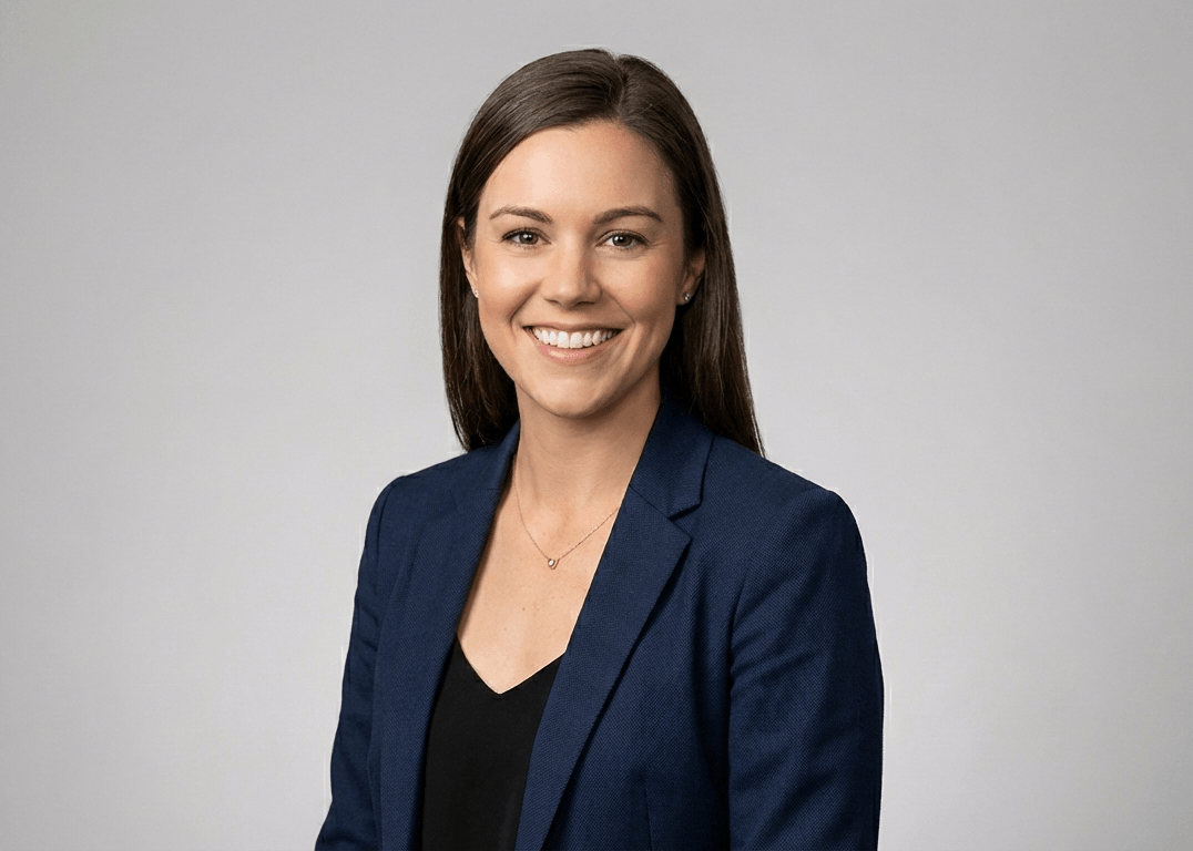 Executive headshot on grey background for Main Line professional